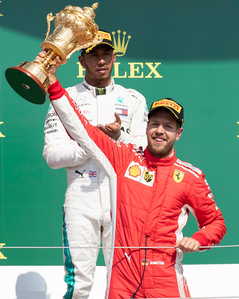 Vettel celebrates his victory on the podium