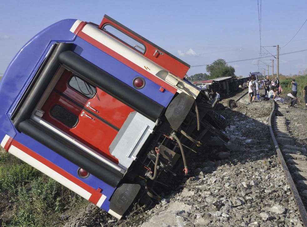 At least 10 people were killed when several carriages derailed after heavy rain
