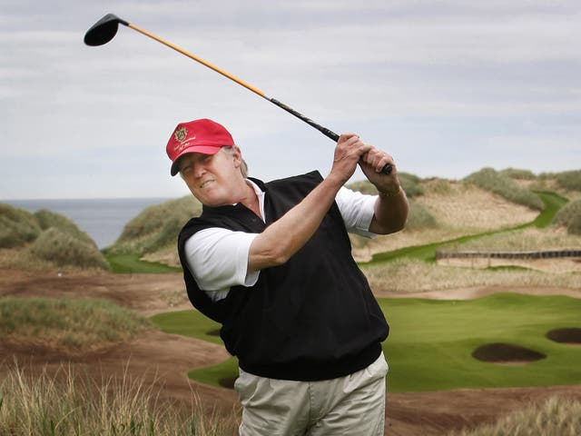 <p>Donald Trump hacks his way out of the rough on his Scottish golf course </p>