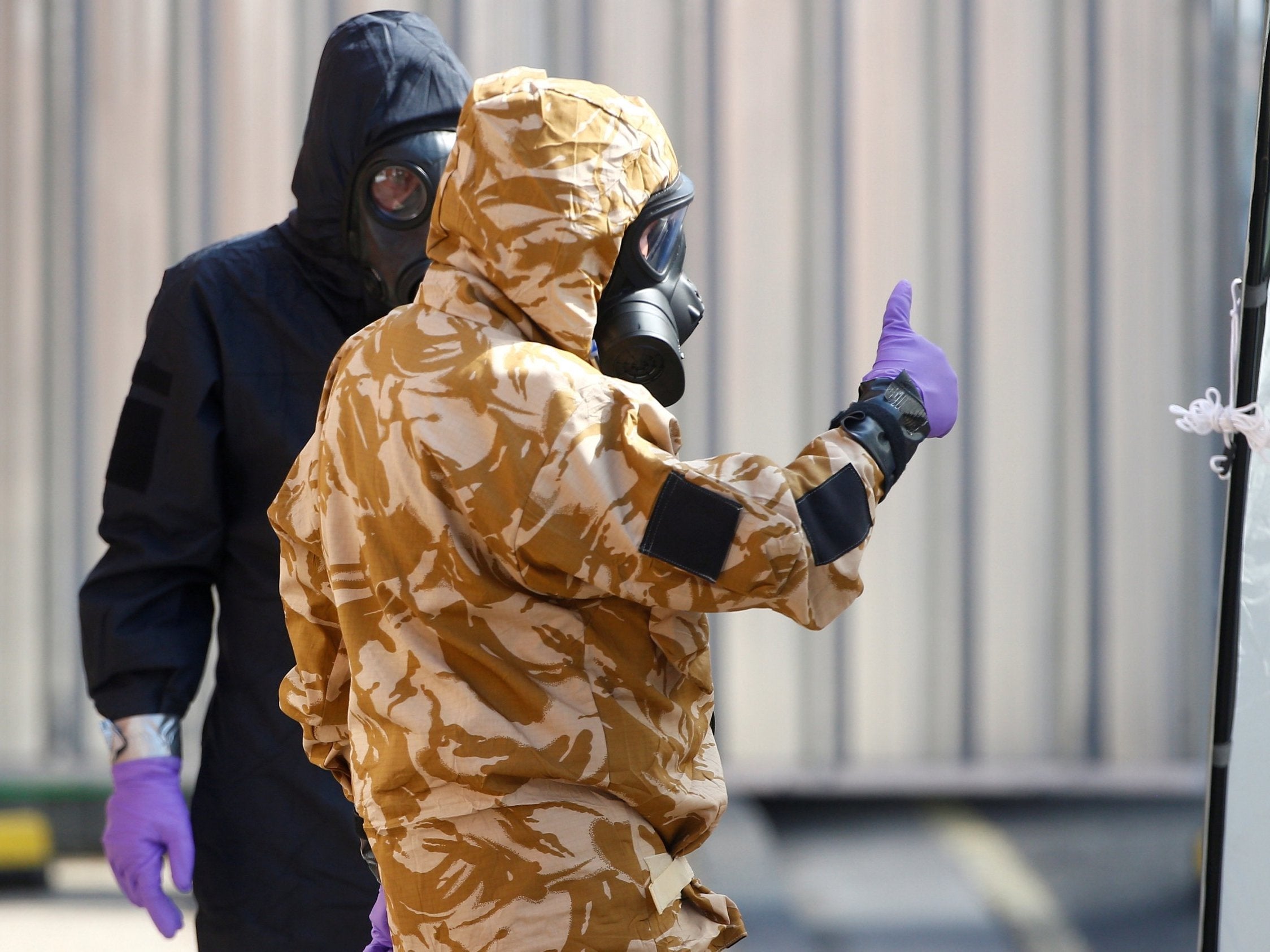 Forensic investigators, wearing protective suits, in Amesbury, 6 July (REUTERS)