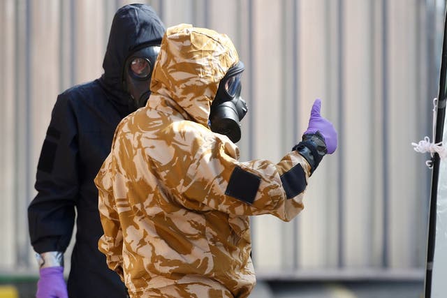 Forensic investigators, wearing protective suits, in Amesbury, 6 July