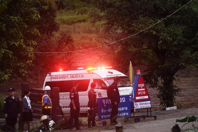 An ambulance leaves the Tham Luang cave complex after divers rescued some of the boys trapped inside
