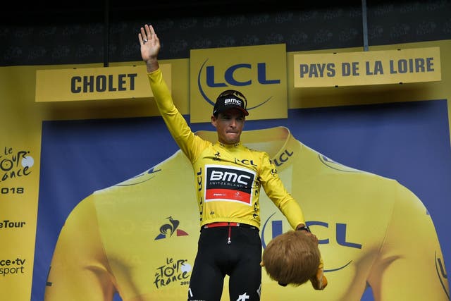 Greg van Avermaet celebrates claiming the yellow jersey