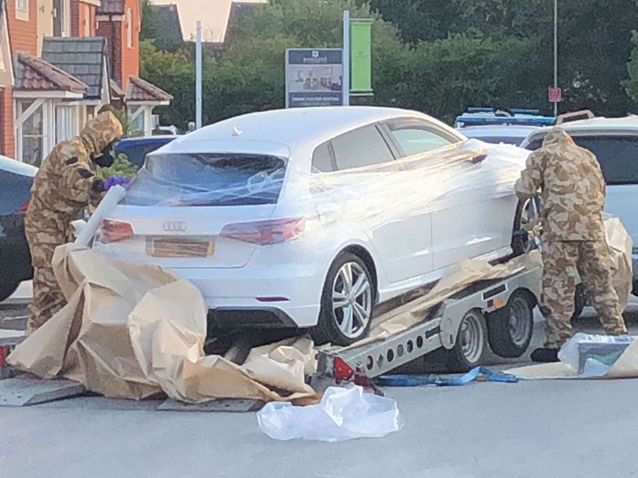 Police and military personnel seized a car from a quiet residential street in Swindon as part of their ongoing investigation into the nerve agent incident in Salisbury and Amesbury on 9 July (James Street/SWNS)