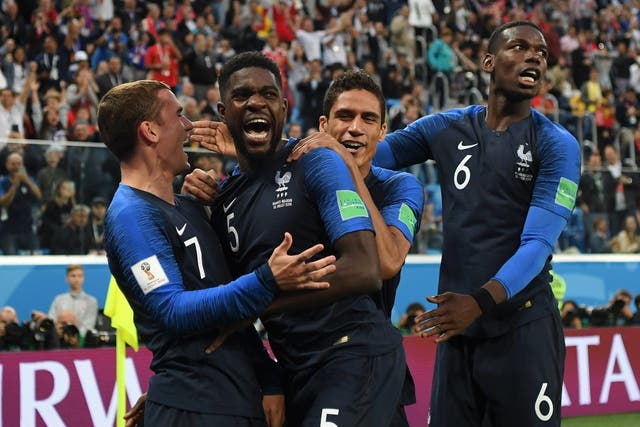 Samuel Umtiti of France celebrates with teammates after scoring