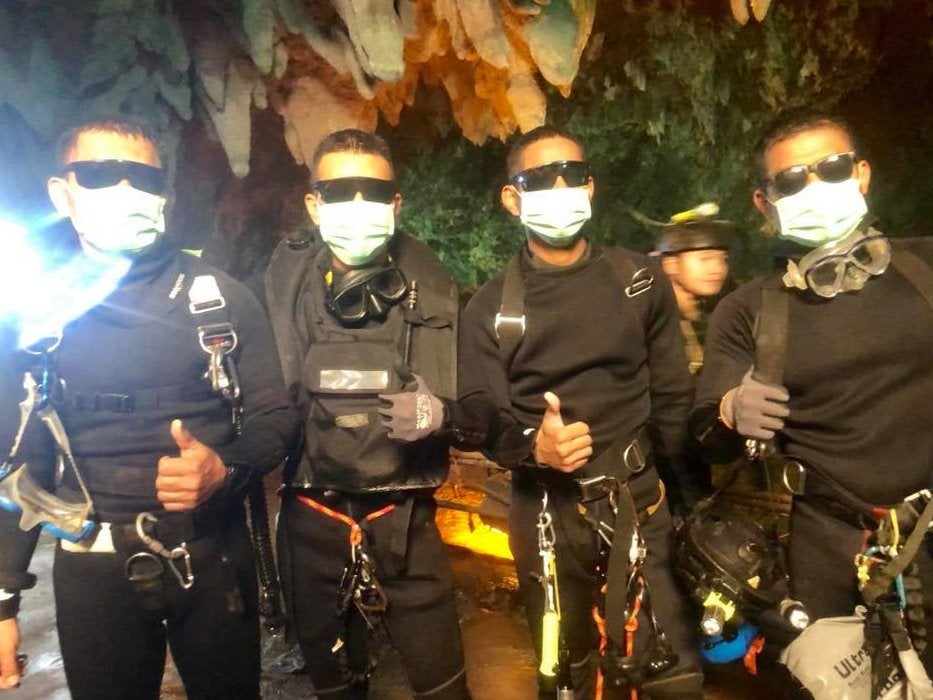 The last four Thai navy Seal divers emerge?from the?cave on Tuesday night (Thai navy Seal/Getty)