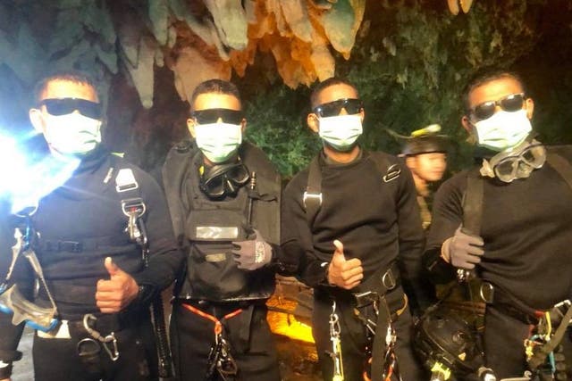 The last four Thai navy Seal divers come out of the cave on Tuesday night