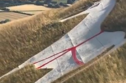 English Heritage hasremoved the red cross from the hill figure on the slope of Salisbury Plain in Wiltshire down after it received complaints