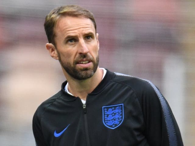 England's head coach Gareth Southgate stands on the pitch