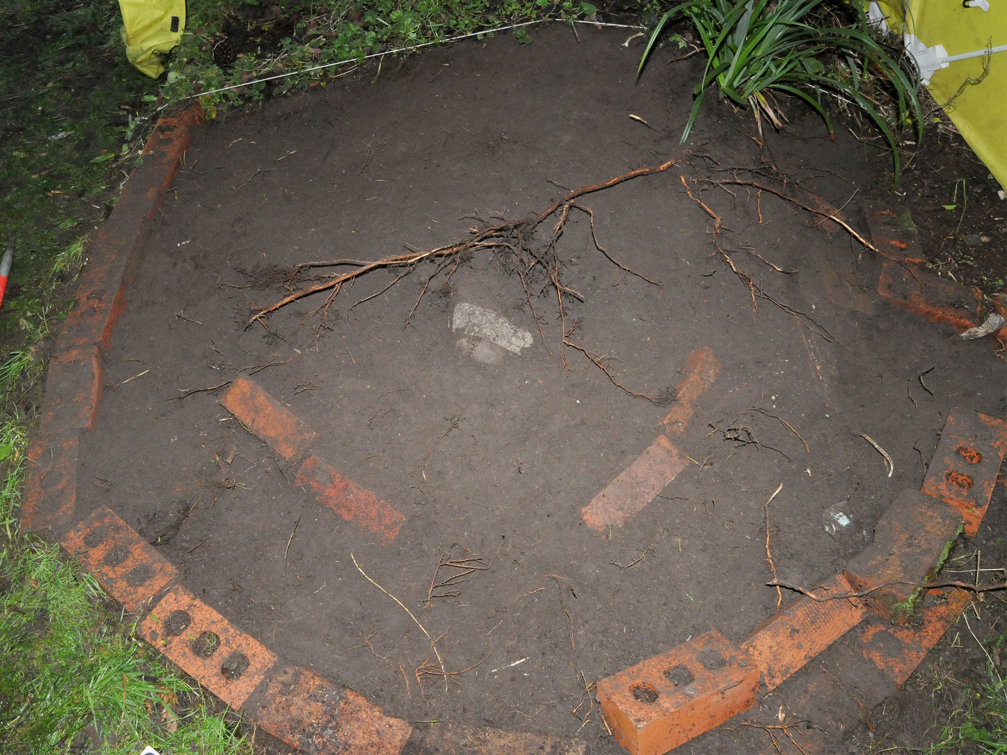 The site where Kenneth Coombes was buried beneath more than a tonne of soil in his garden