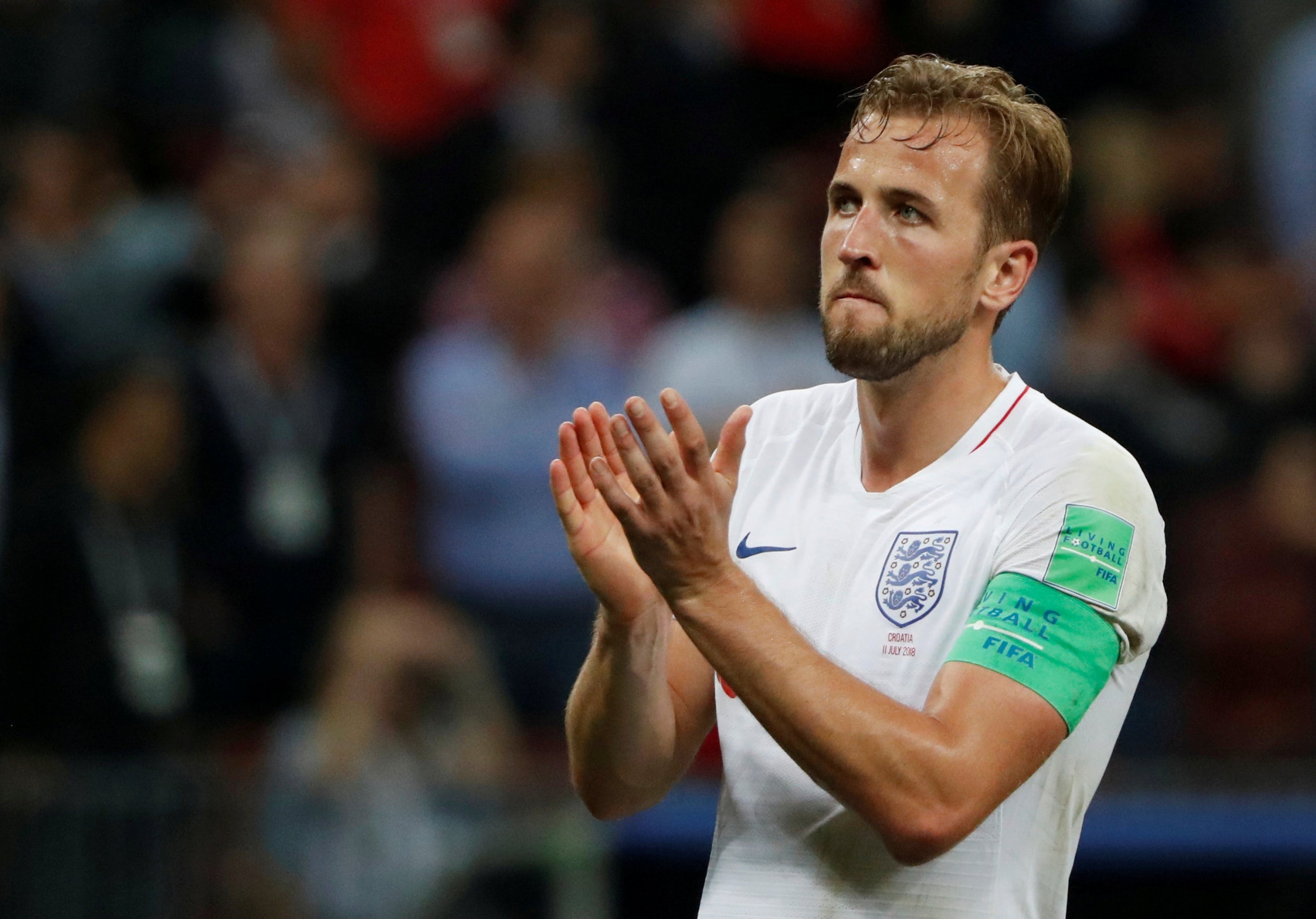 Harry Kane applauds England's fans after defeat