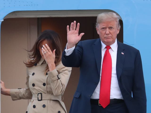 US President Donald Trump and US First Lady Melania Trump disembark from Air Force One