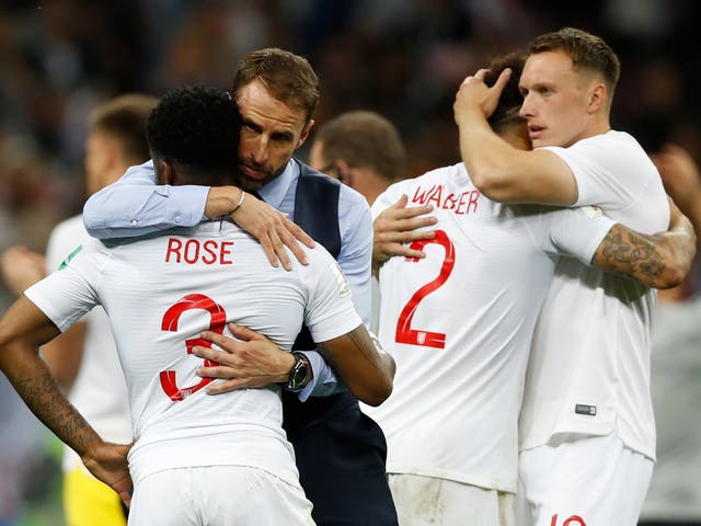 England head coach Gareth Southgate comforts England's Danny Rose