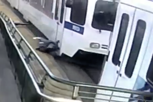 Surveillance footage shows a man being dragged by a train in Denver