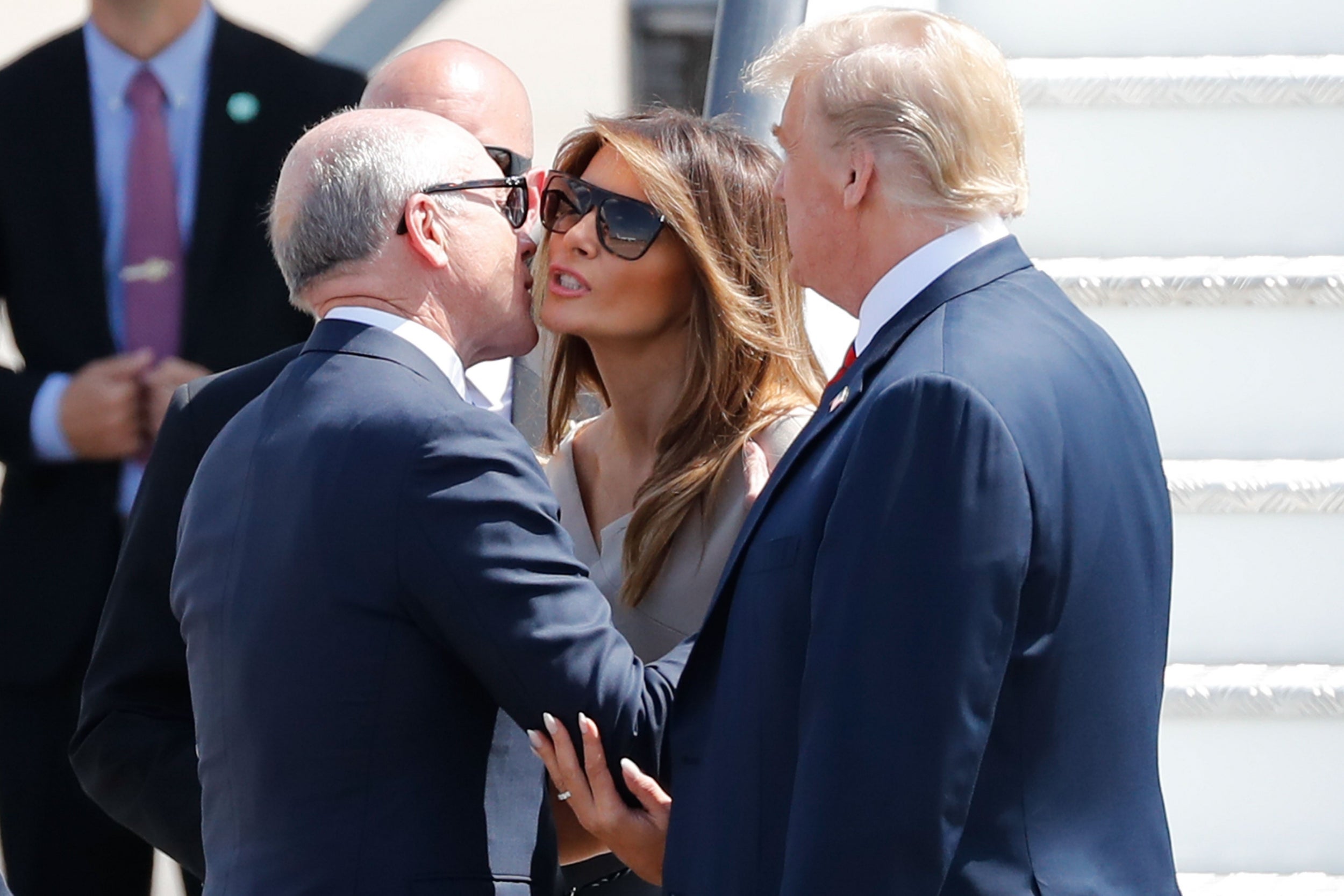 Woody Johnson, the US ambassador to the UK, greets Melania and Donald Trump on their UK visit in July