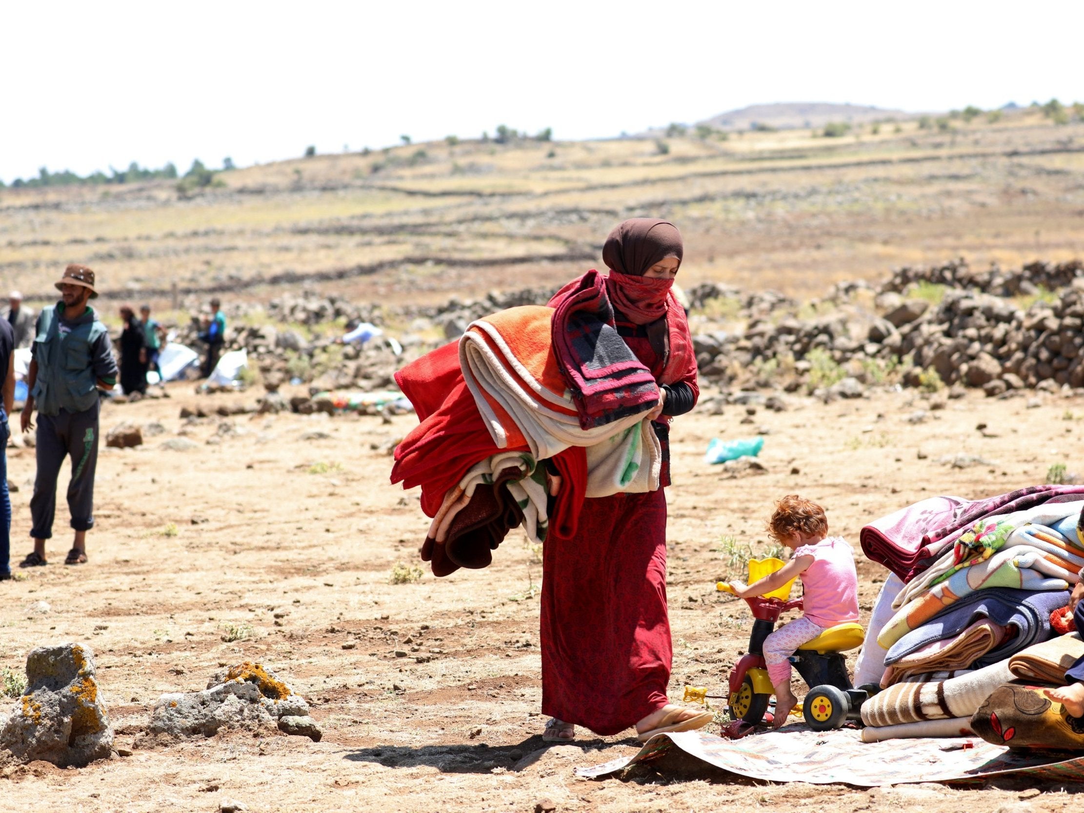 A displaced woman from Deraa province near the Israeli-occupied Golan Heights