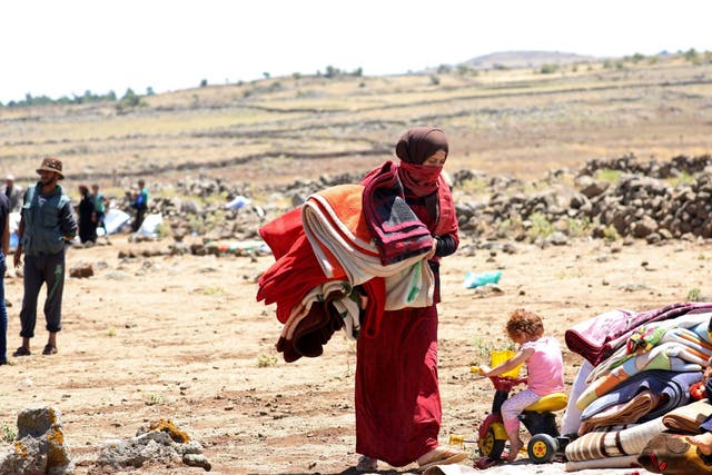 A displaced woman from Deraa province near the Israeli-occupied Golan Heights