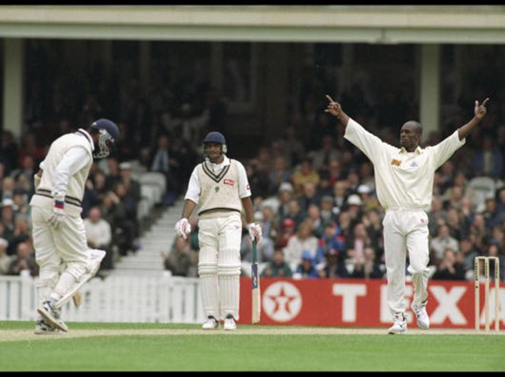 Chris Lewis celebrates the wicket of India's Sanjay Manjreker in 1996