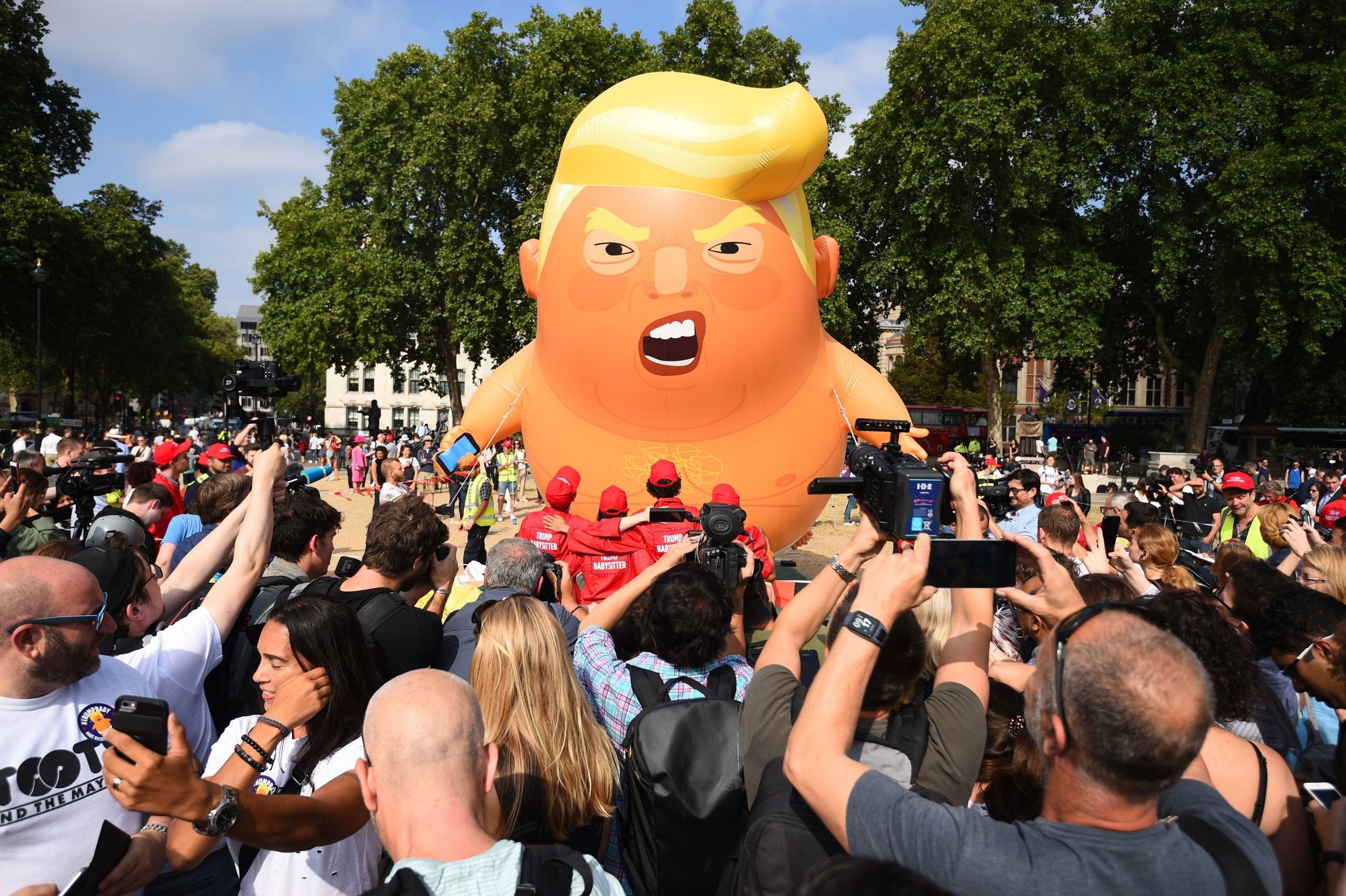 Baby Trump blimp balloon rises after being inflated in London’s Parliament Square ahead of his visit in 2018