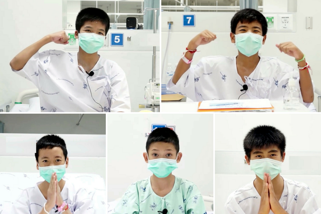 Images from video showing some of the 12 boys rescued from the flooded cave in their hospital room at Chiang Rai Prachanukroh Hospital in Chiang Rai province, northern Thailand
