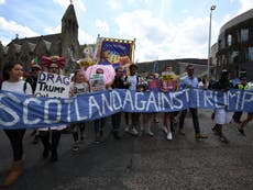 Tens of thousands protest as Trump plays golf in Scotland