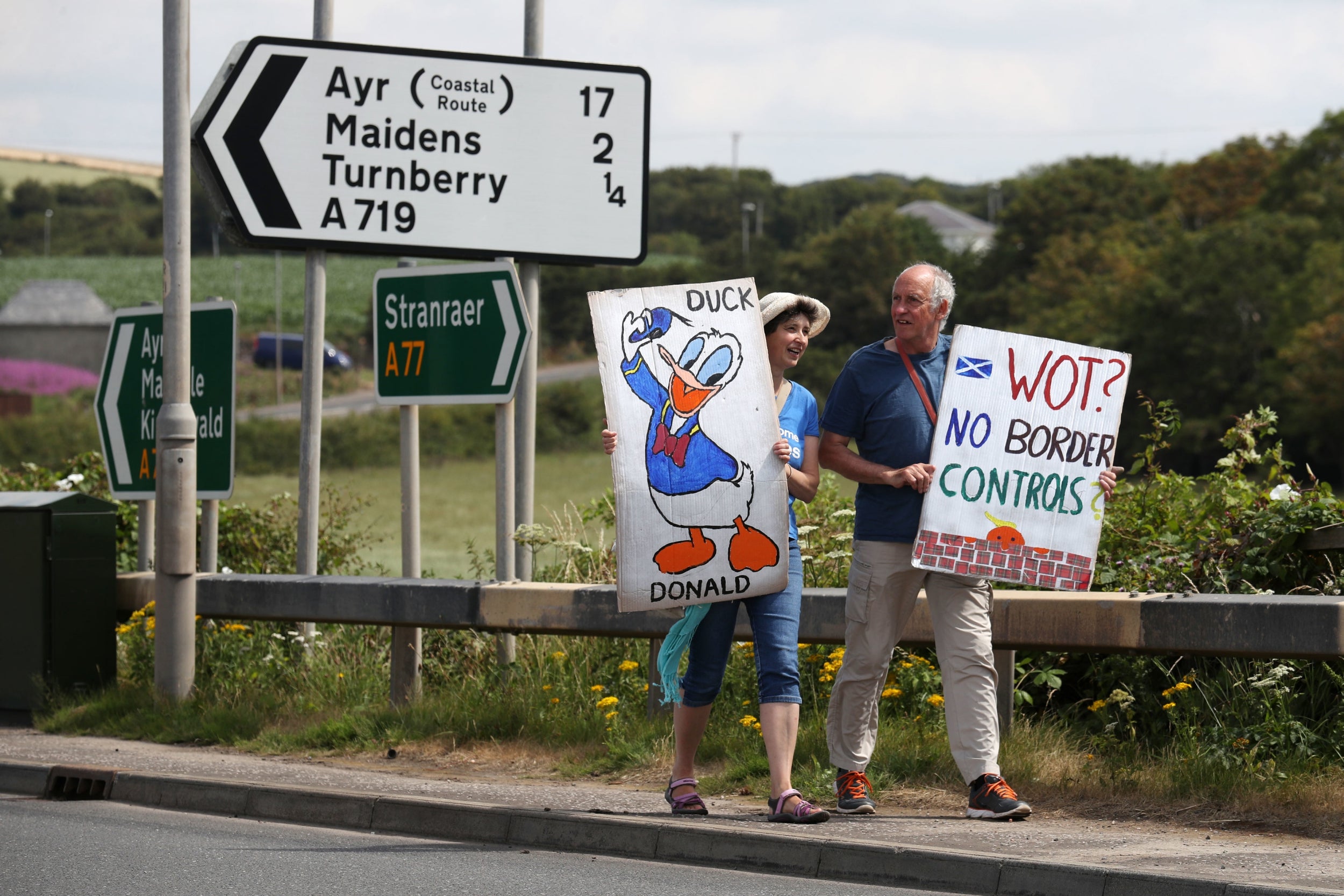 Protesters await Trump’s arrival near to his golf course at Turnberry, Ayrshire