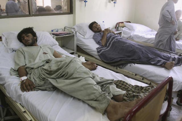 Casualties injured in Friday's suicide bombing in Mastung are treated at a hospital in Quetta, Pakistan, Saturday, July 14, 2018.