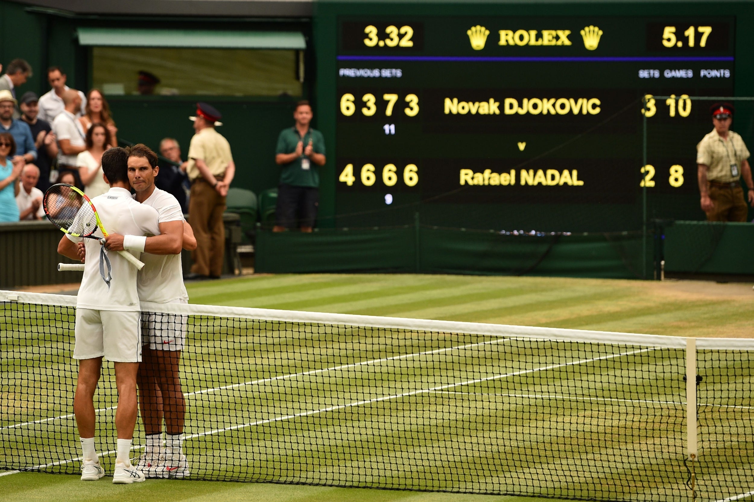 Nadal and Djokovic embrace at the net after their semi-final in 2018