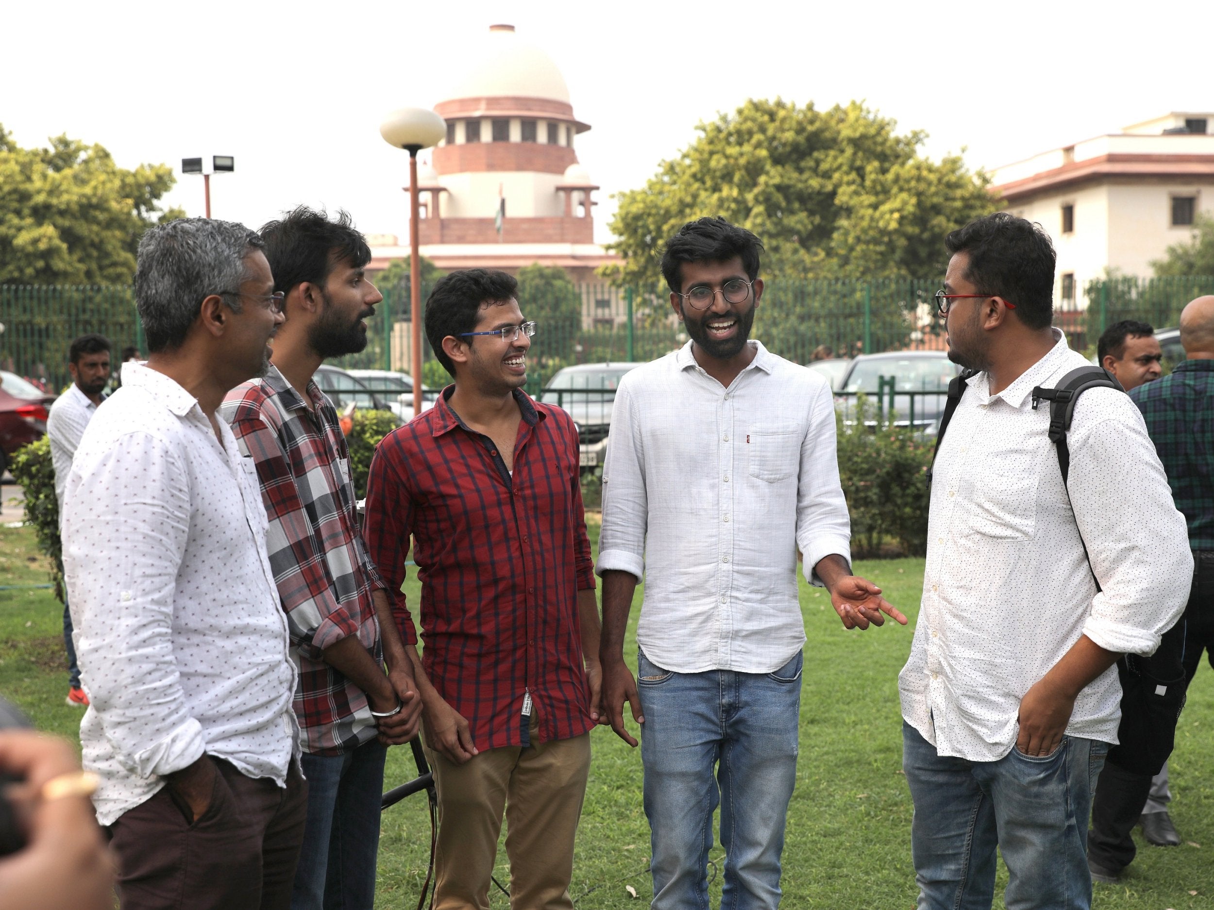 LGBT+ activists stand before law makers as they begin hearings regarding Section 377, which could be the country's greatest breakthrough for same sex rights