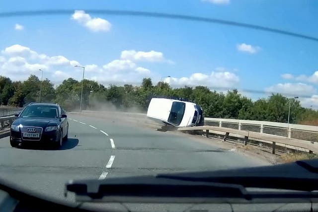 This video shows the see-it-to-believe-it moment when a van driver dices with death by grinding along the edge of a road bridge