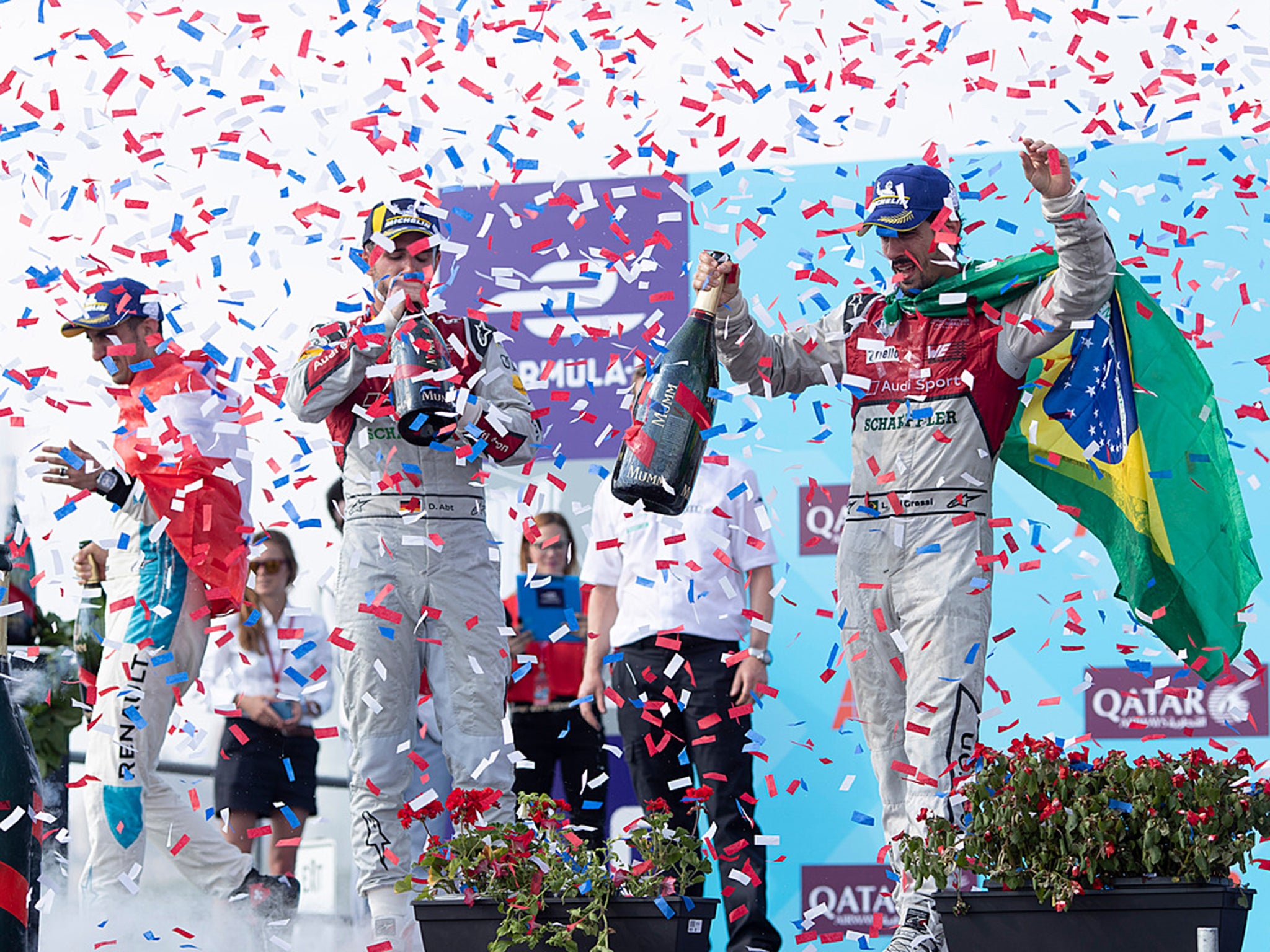 Race winner Lucas di Grassi celebrates an Audi one-two on the podium