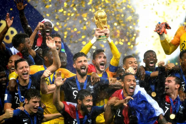 Hugo Lloris of France lifts the World Cup trophy to celebrate with his teammates