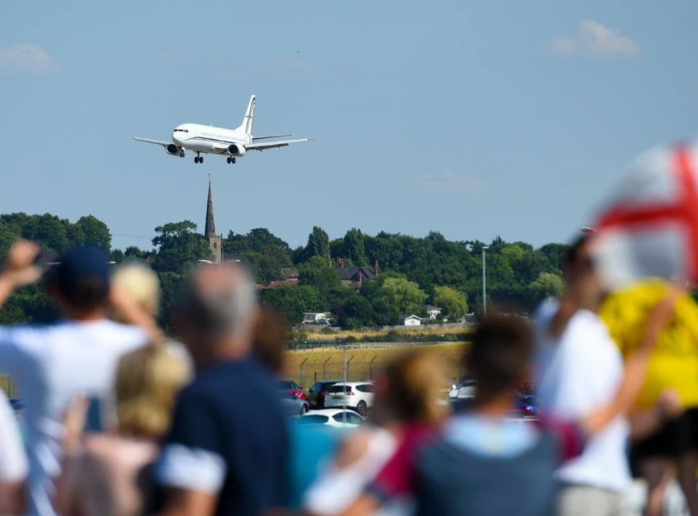 Some fans defied requests to stay away and watched the England team's plane land