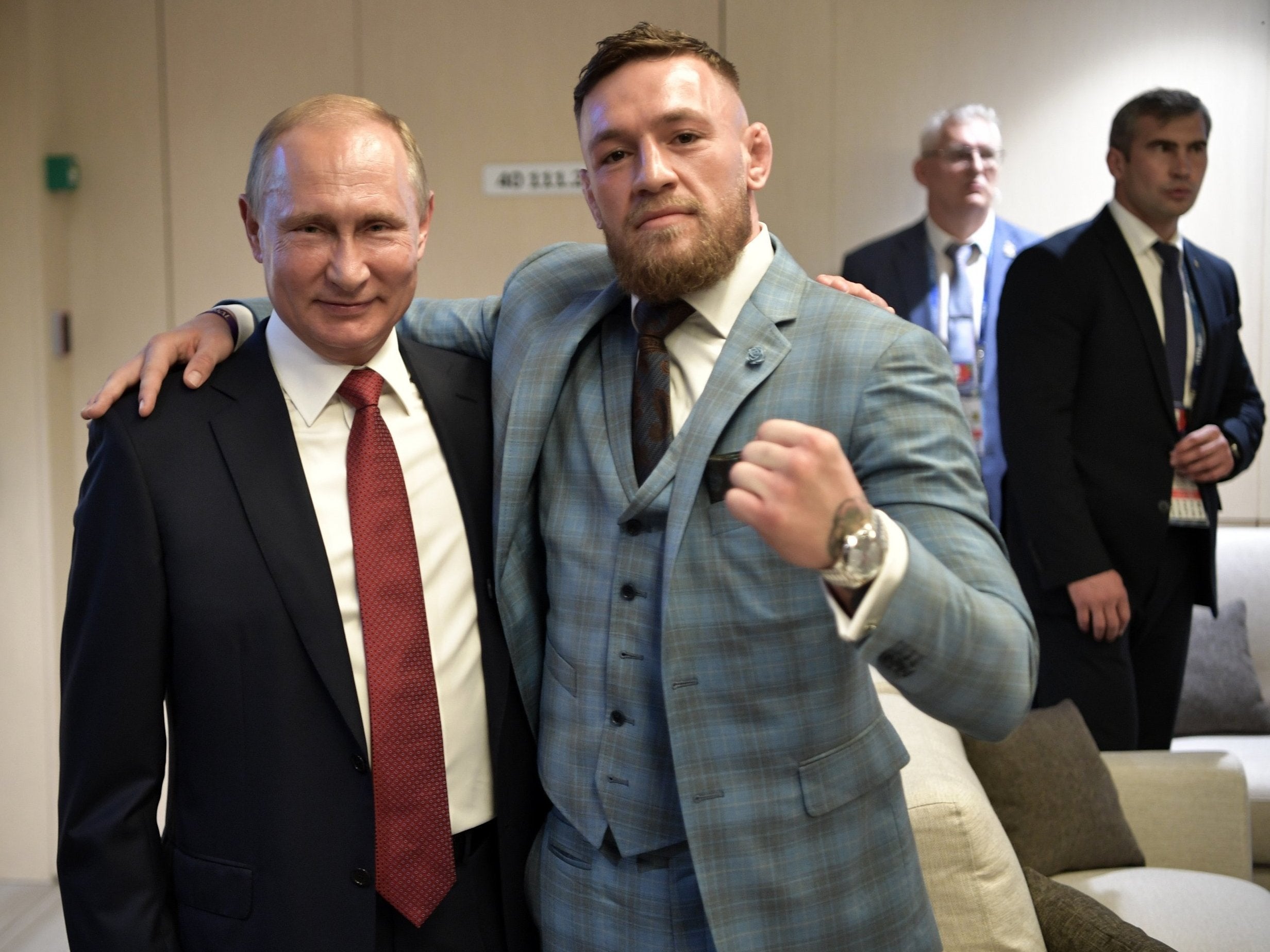 Russia president Vladimir Putin poses for a picture with UFC star Conor McGregor