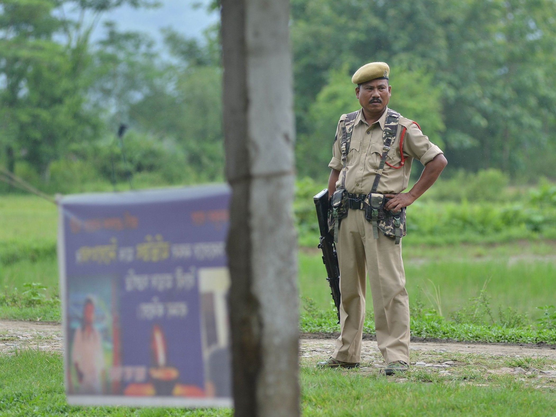 Indian security personnel near the site of the lynching of two men in Panjuri Kachari village, sparked by rumours spread on Facebook and WhatsApp in India, 10 July
