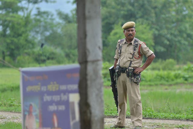 Indian security personnel near the site of the lynching of two men in Panjuri Kachari village, sparked by rumours spread on Facebook and WhatsApp in India, 10 July