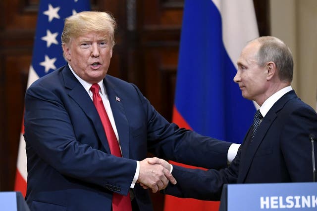 Donald Trump and Russia's President Vladimir Putin shake hands after their joint news conference in the Presidential Palace in Helsinki, Finland July 16, 2018.