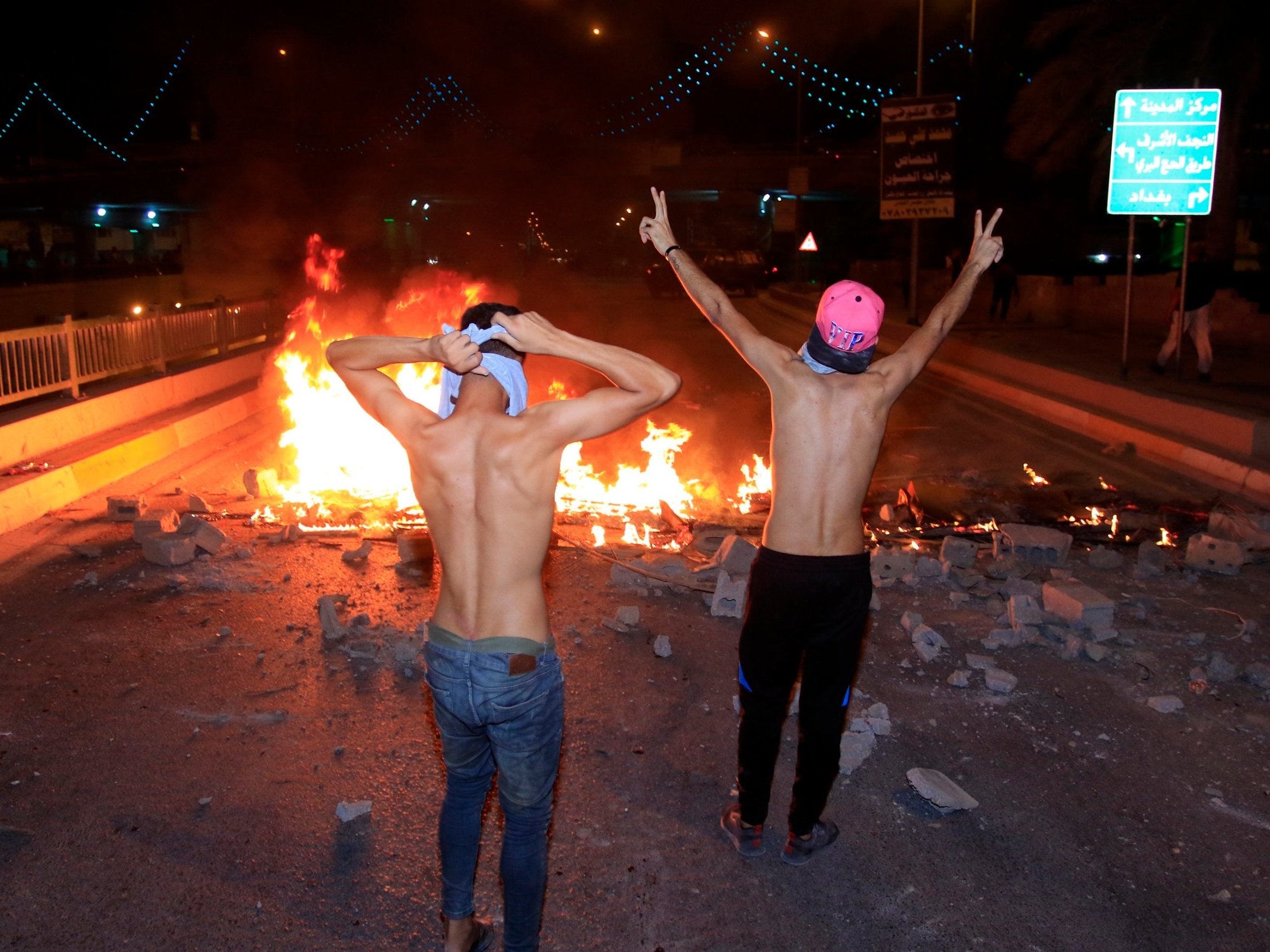 Iraqis burn tyres during a demonstration in Karbala city, southern Iraq