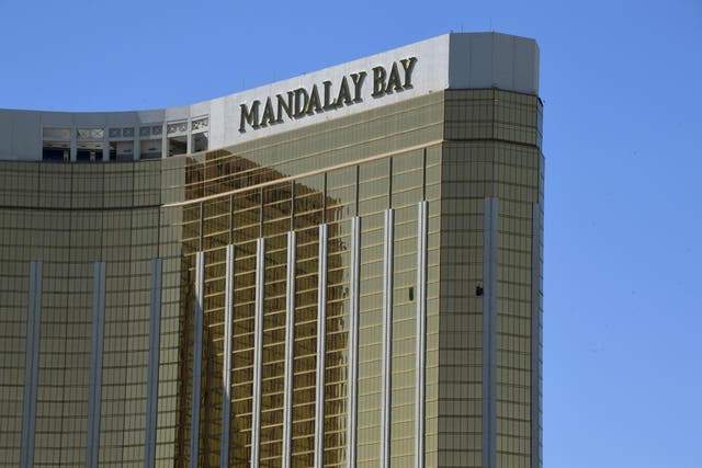 The damaged windows on the 32nd floor room that was used by the shooter in the Mandalay Hotel after a gunman killed at least 58 people