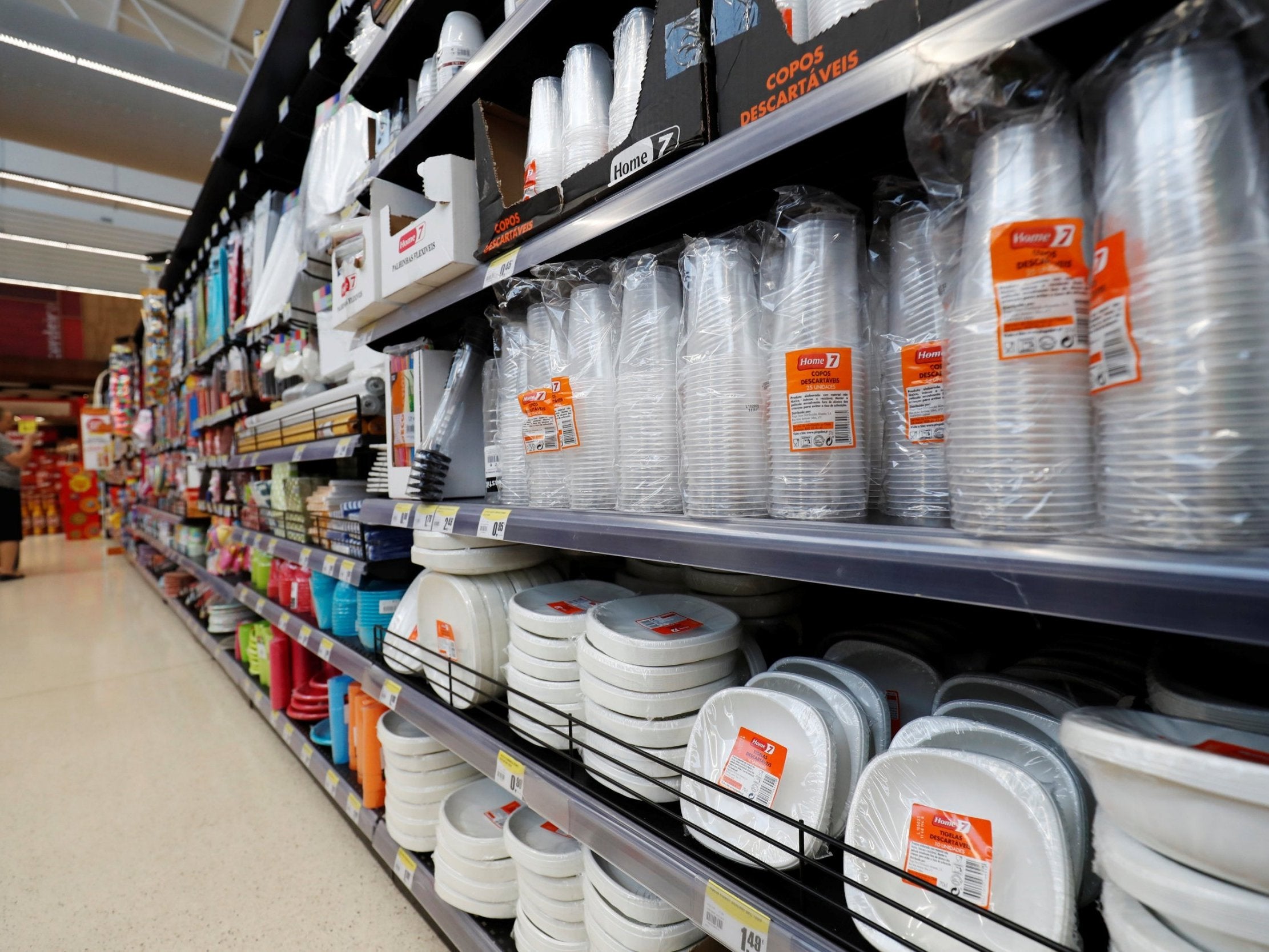 Plastic cups and other products are seen on sale in a supermarket