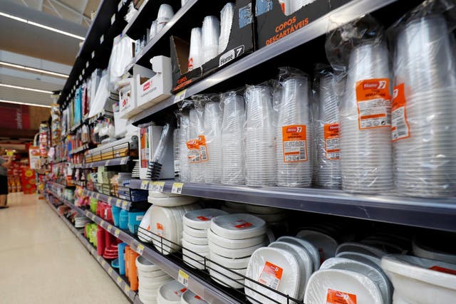 Plastic cups and other products are seen on sale in a supermarket