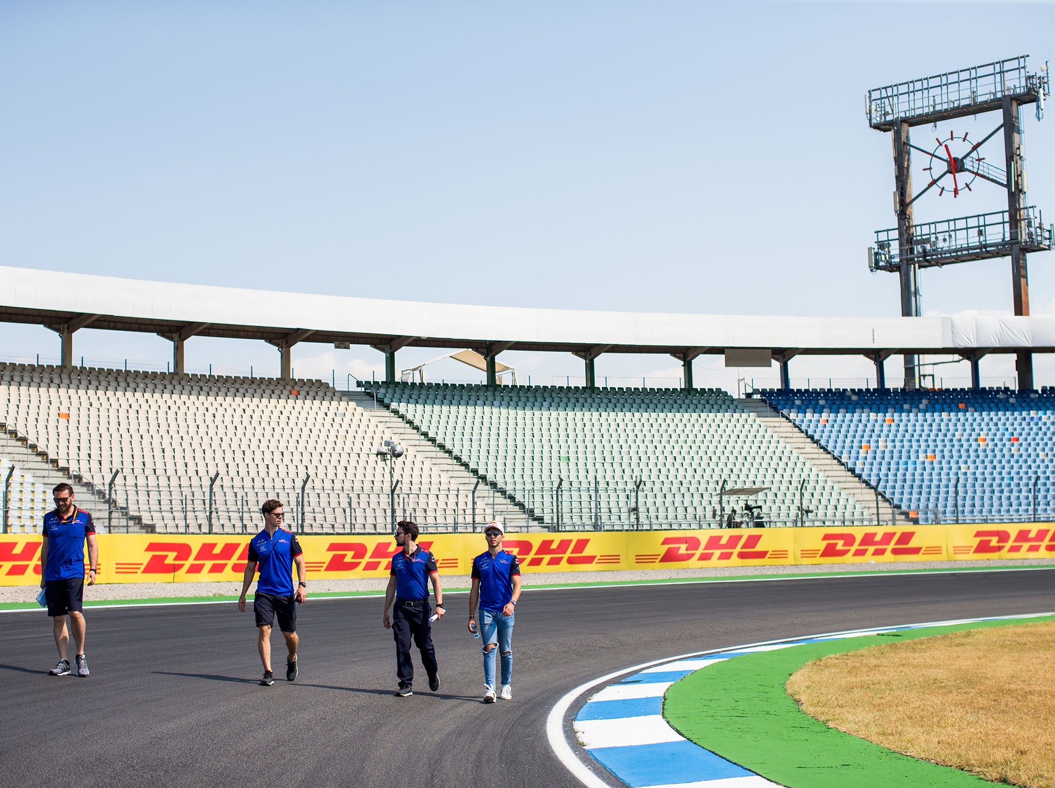 Drivers inspect the track