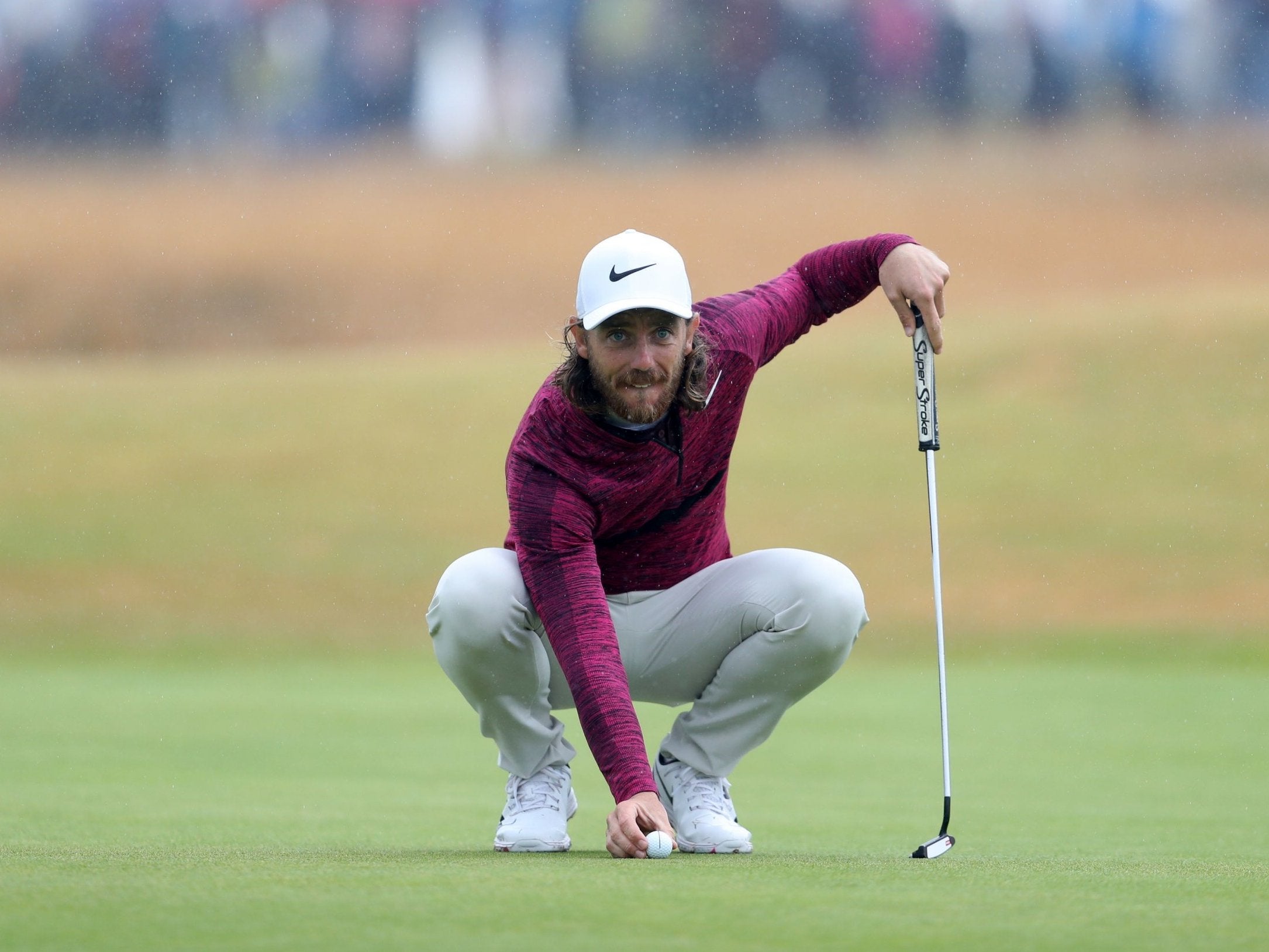 England's Tommy Fleetwood lines up a putt on the 15th green