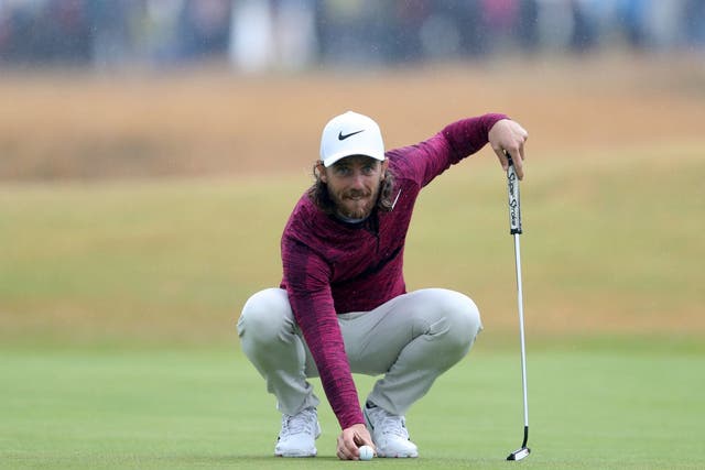 England's Tommy Fleetwood lines up a putt on the 15th green