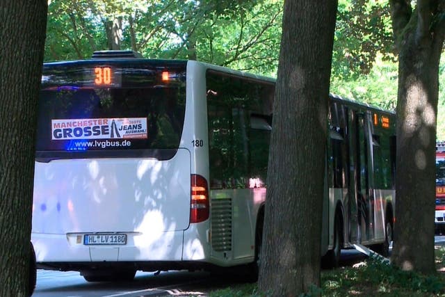 Bus sits on street in Lubeck after man attacks people inside