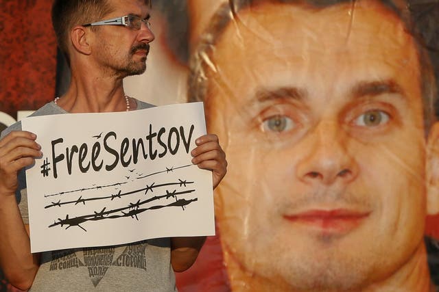 A participant attends a rally demanding the release of film director Oleg Sentsov at the Independence Square in Kiev, Ukraine, 13 July