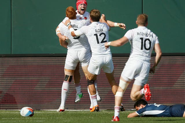 Phil Burgess celebrates after scoring a try to send England into the Sevens Rugby World Cup semi-finals
