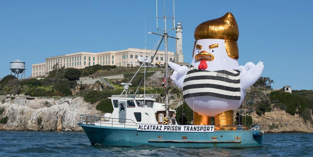 Trump blimp 33foot inflatable 'chicken' dressed in a prison outfit to