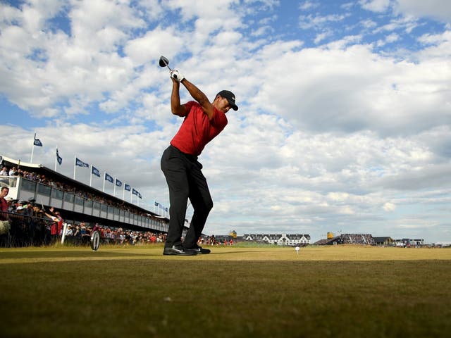 Tiger Woods of the United States tees off at the 18th hole