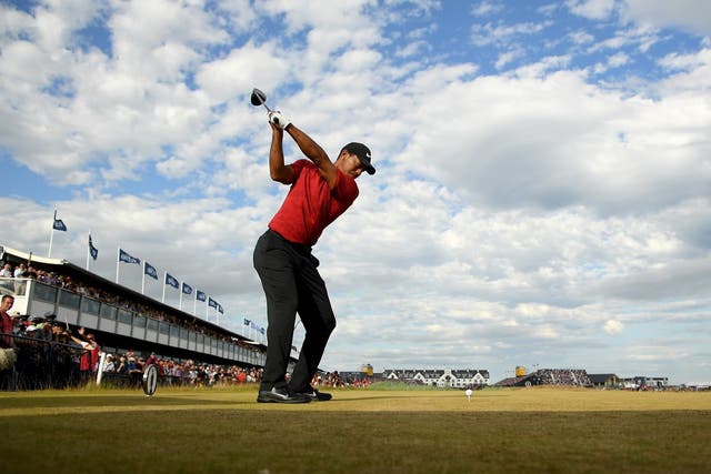 Tiger Woods of the United States tees off at the 18th hole
